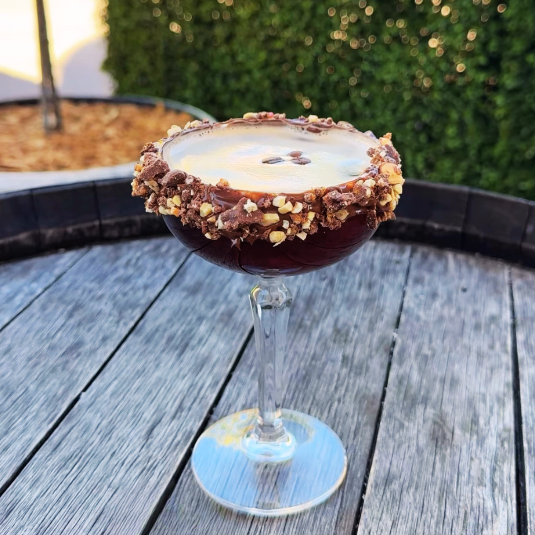 An espresso martini rimmed with Pebbly Path's honeycomb ice cream crumble