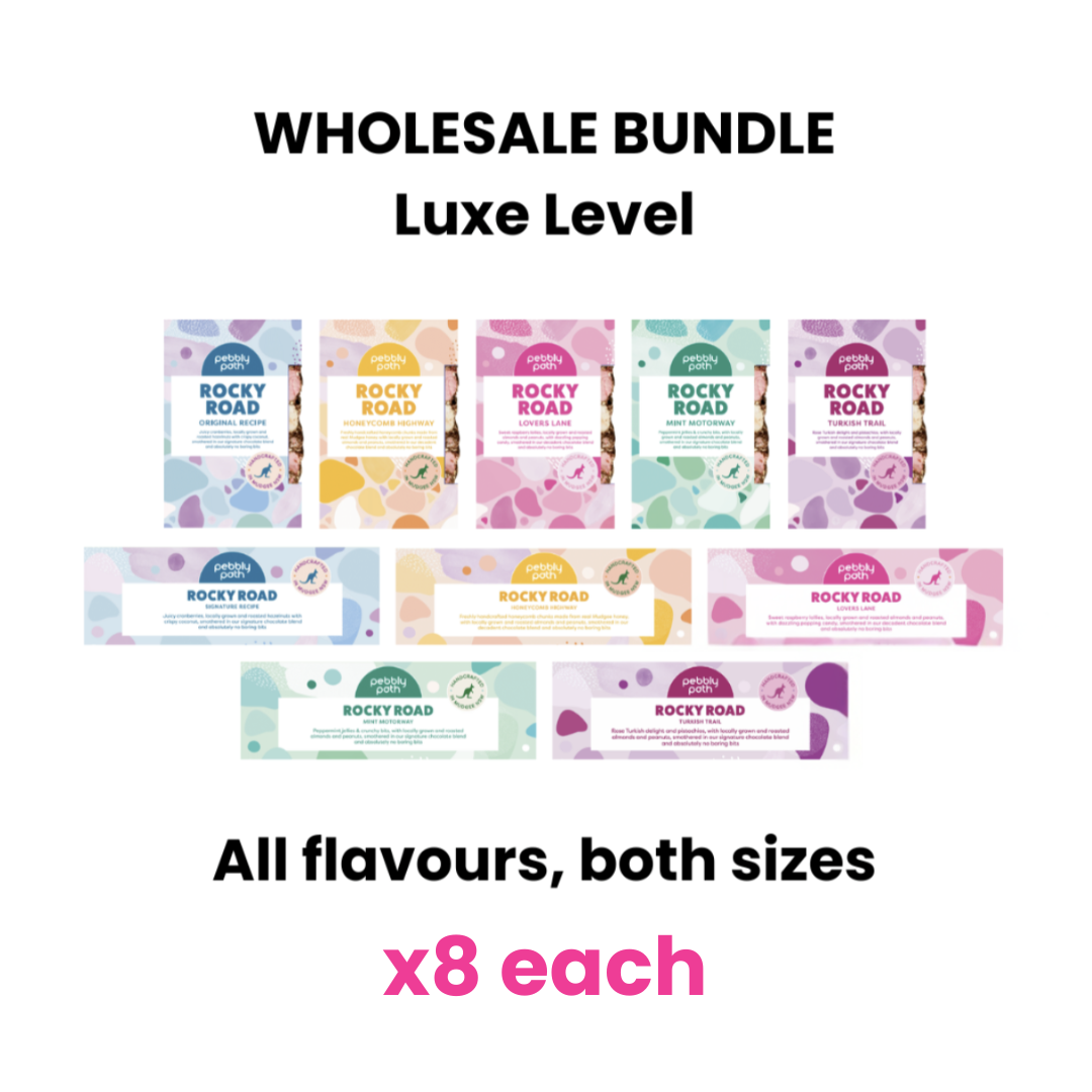 Pebbly Path Luxe Level Wholesale Bundle showing all five rocky road flavours in both bar sizes, with eight of each product displayed in a wholesale assortment.
