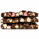 Pebbly Path Black Forest Boulevard Rock Road 200g shown in close-up, with dark chocolate, pink and white marshmallow, and chopped nuts visible in the rocky road.