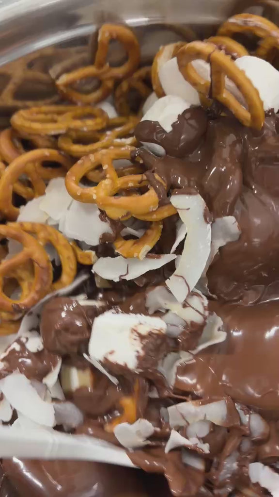 Pebbly Path Salted Caramel Causeway Rocky Road handmade production process with jersey caramels, crunchy pretzels, fluffy marshmallows and salted chocolate being mixed and prepared by hand